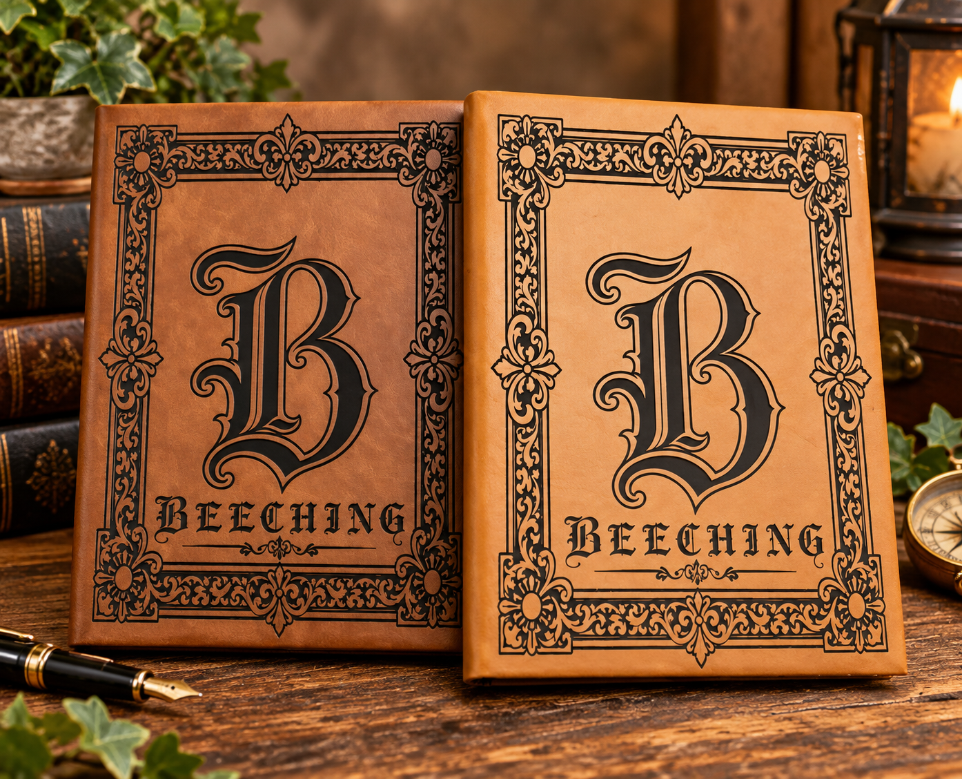 Two tan leatherette journals laser-engraved with ornate Victorian border and large letter B with the name Beeching