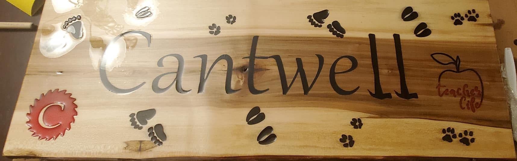 Cantwell live-edge wood sign with paw prints and apple laser engraved