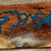 Walnut slab with blue epoxy resin river close-up