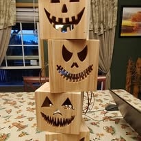 Stacked carved wooden jack-o-lantern Halloween boxes