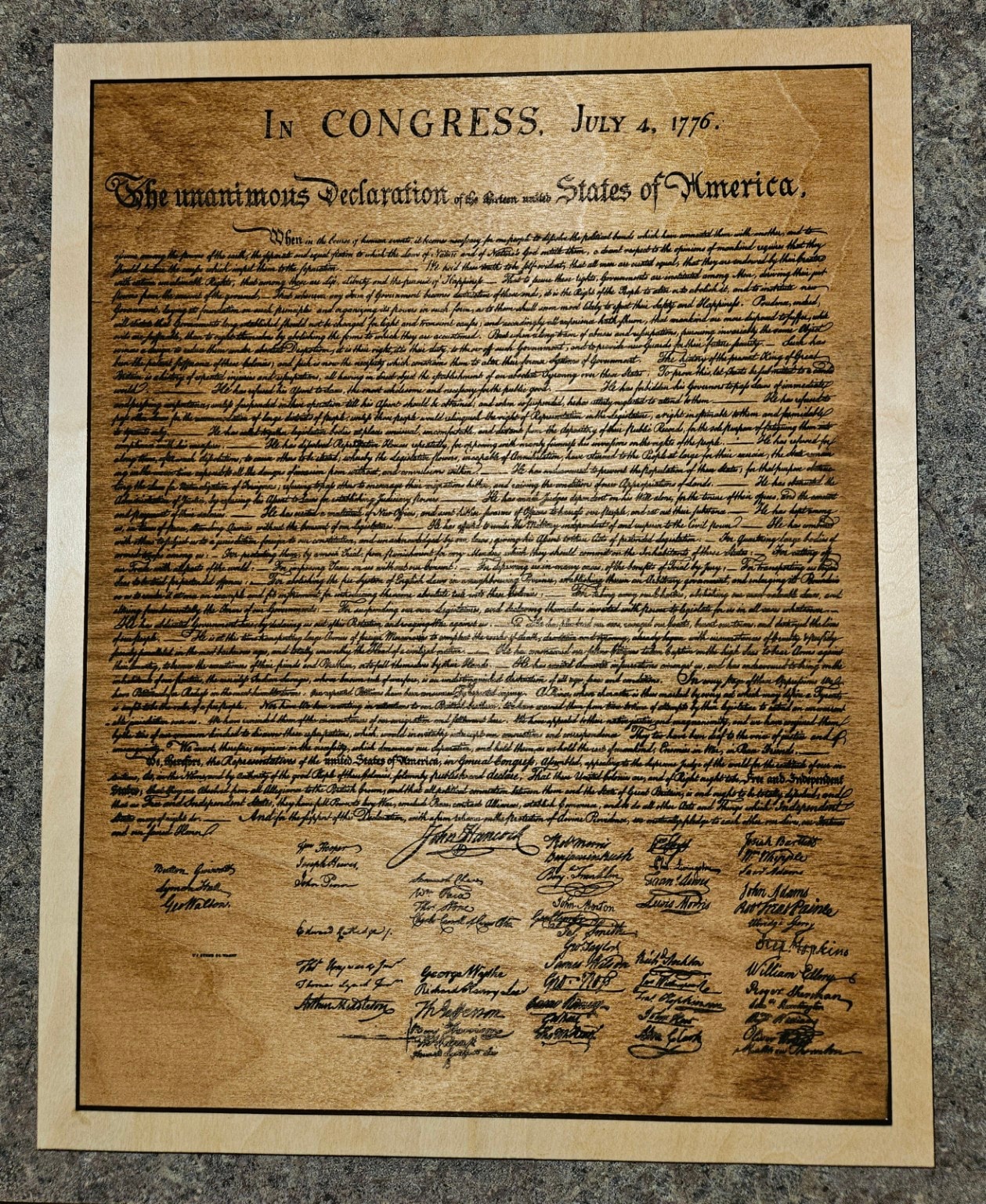 Wood-burned Declaration of Independence replica on light wood