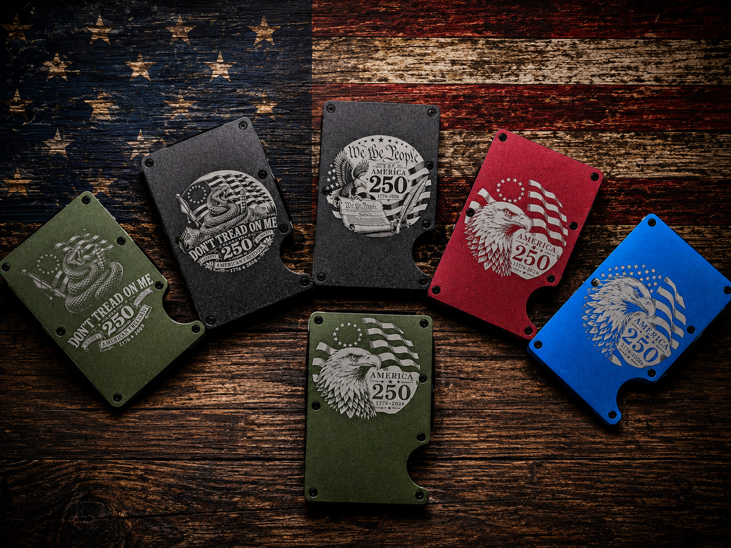 Collection of aluminum wallets in multiple colors engraved with America 250 patriotic designs